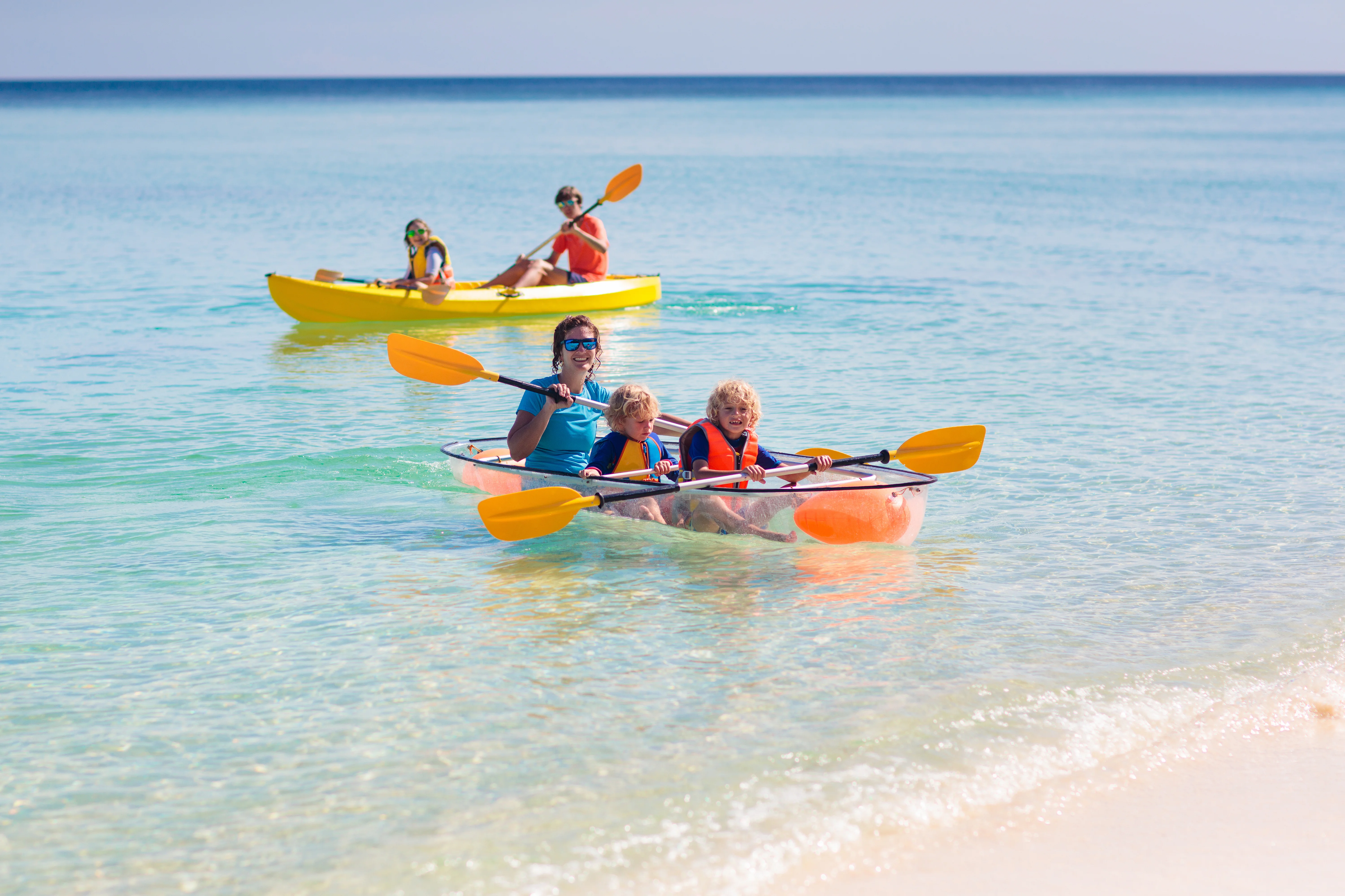 a group of people in kayaks