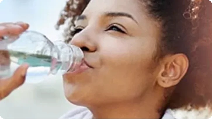 a child drinking from a bottle